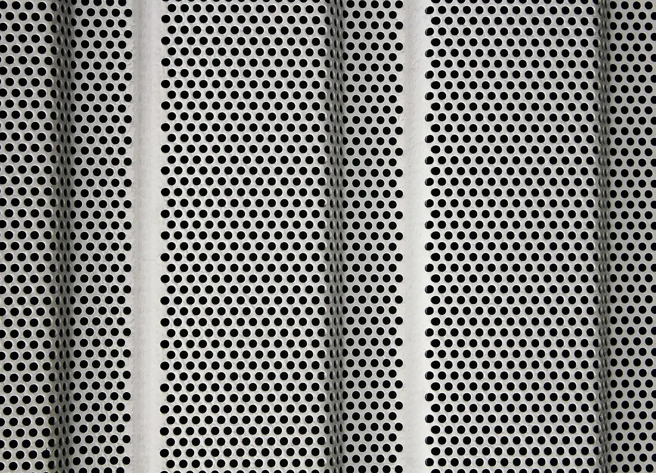 Laser-cut perforated metal sheet with a regular hole pattern